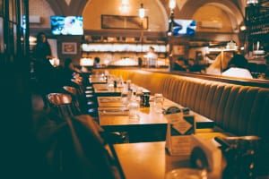 restaurant with empty booths and tables