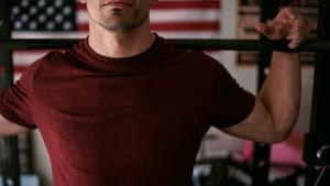 man in red shirt exercising